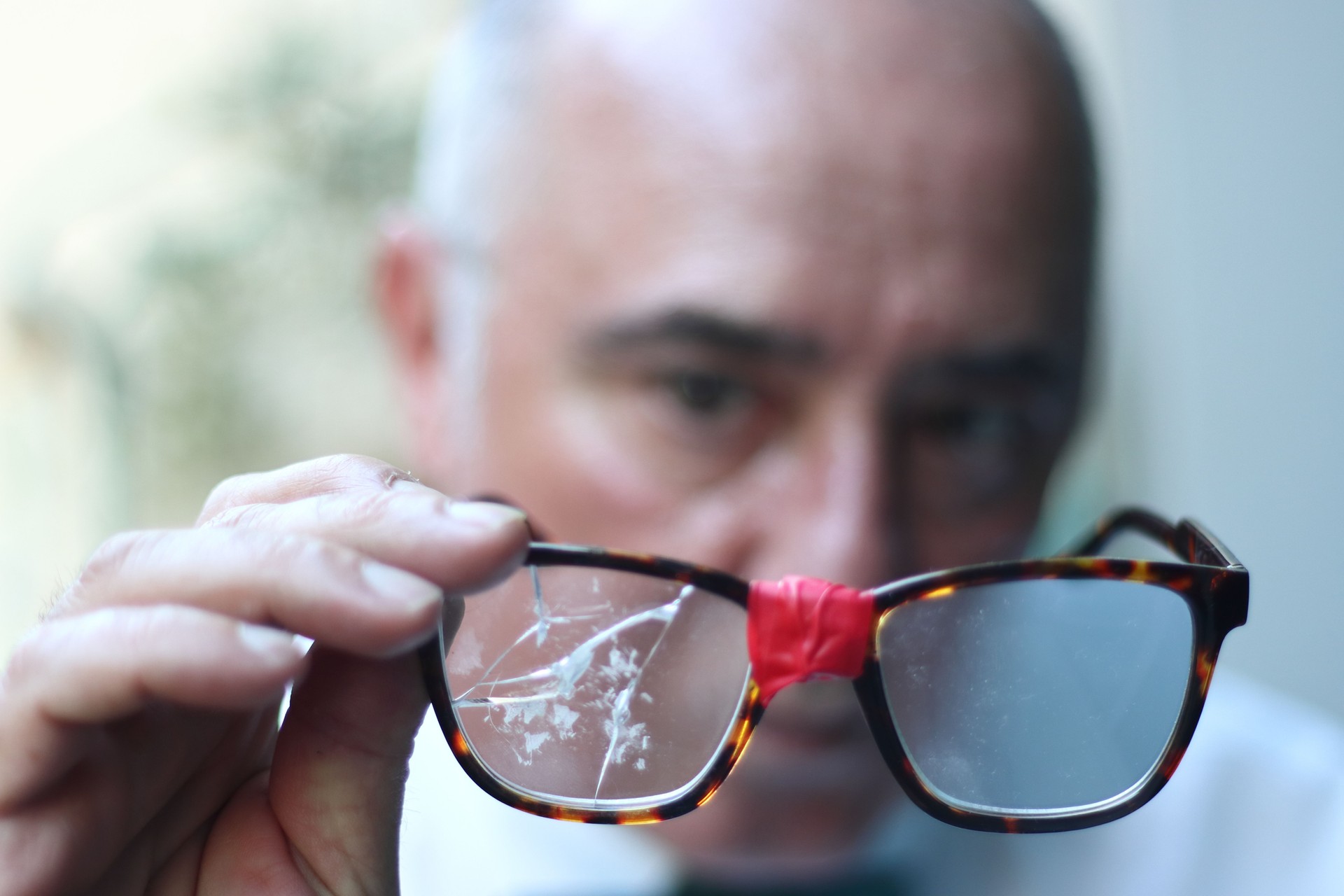 New, broken, old glasses. Replace glasses. Glasses on sale. Progressive lenses. Man with glasses.